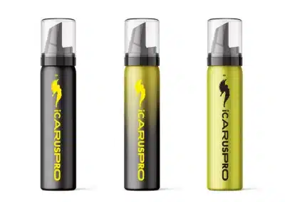 Three spray bottles stand upright in a row. Each bottle has a transparent cap and nozzle, with ICARUSPRO written vertically in yellow. The left and middle bottles are black with a yellow winged-horse logo; the right bottle is yellow-green with a black logo. Brand design logo by Twistedgifted.